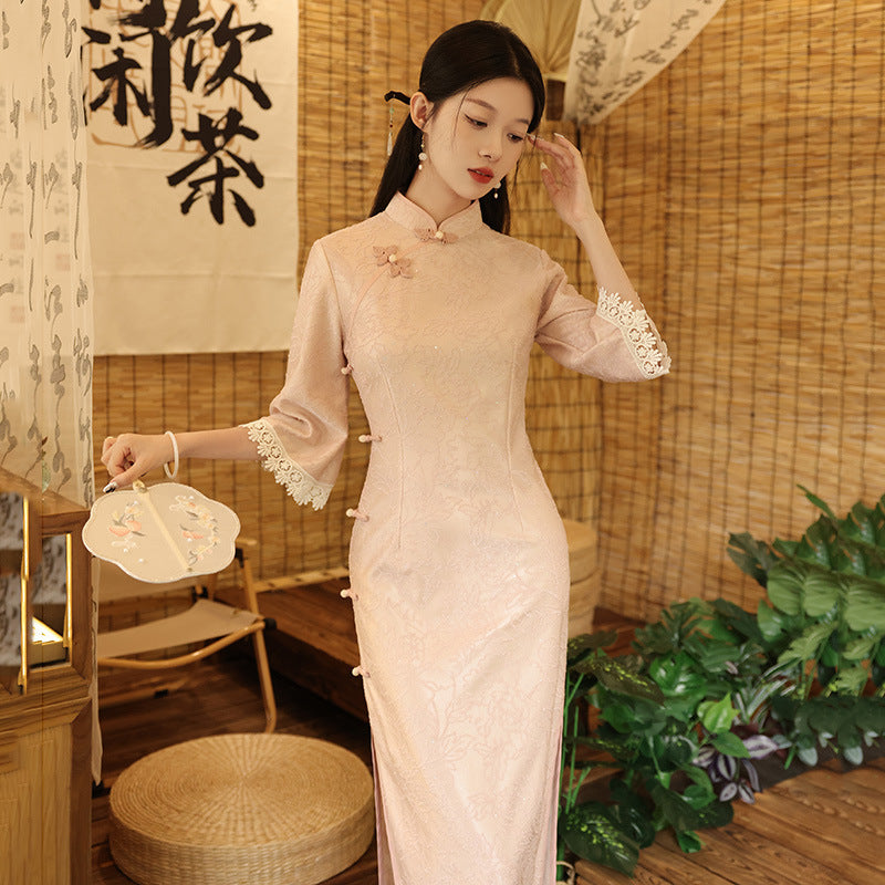 Elegant Pink Qipao Dress with Lace Detailing and Floral Embroidery