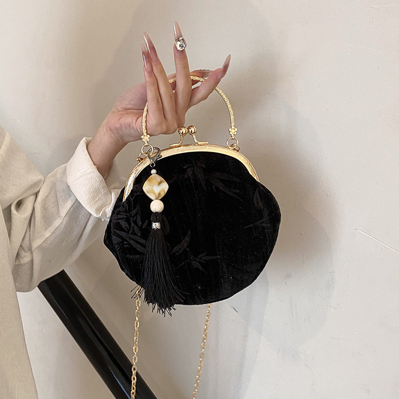 Elegant Velvet Handbag with Gold Chain and Tassel Decoration
