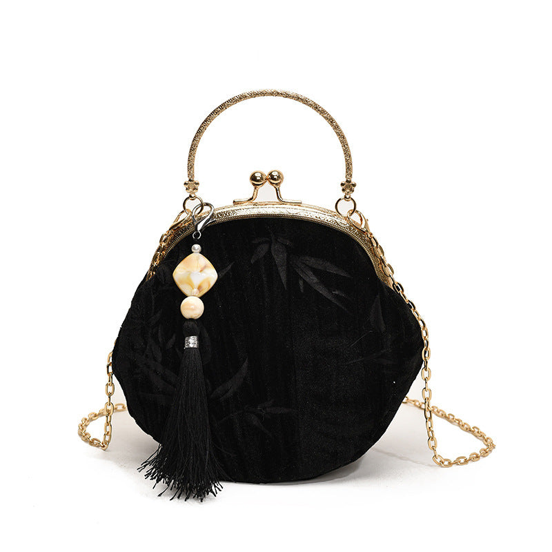 Elegant Velvet Handbag with Gold Chain and Tassel Decoration