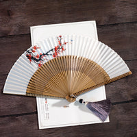 Elegant Bamboo Folding Hand Fan With Plum Blossom Design And Tassel For Hanfu Styling