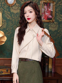 Elegant Beige Blouse with Chinese Knot Detailing for a Traditional and Stylish Look