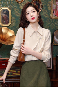 Elegant Beige Blouse with Chinese Knot Detailing for a Traditional and Stylish Look