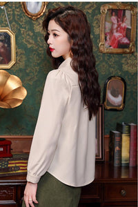 Elegant Beige Blouse with Chinese Knot Detailing for a Traditional and Stylish Look