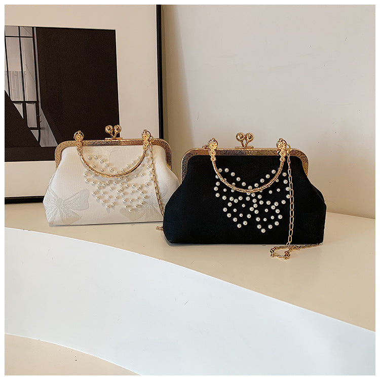 Elegant Pearl-Embellished Butterfly Clutch Bag with Golden Frame