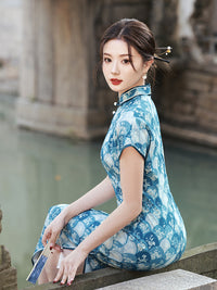 Elegant Blue Cheongsam with Floral Pattern and Mandarin Collar