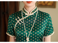 Vintage Green Polka Dot Cheongsam with Mandarin Collar and Pearl Detailing