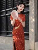 Elegant Orange Polka Dot Cheongsam with Green Accents