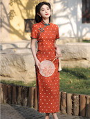 Elegant Orange Polka Dot Cheongsam with Green Accents