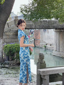 Elegant Blue Cheongsam with Floral Pattern and Mandarin Collar