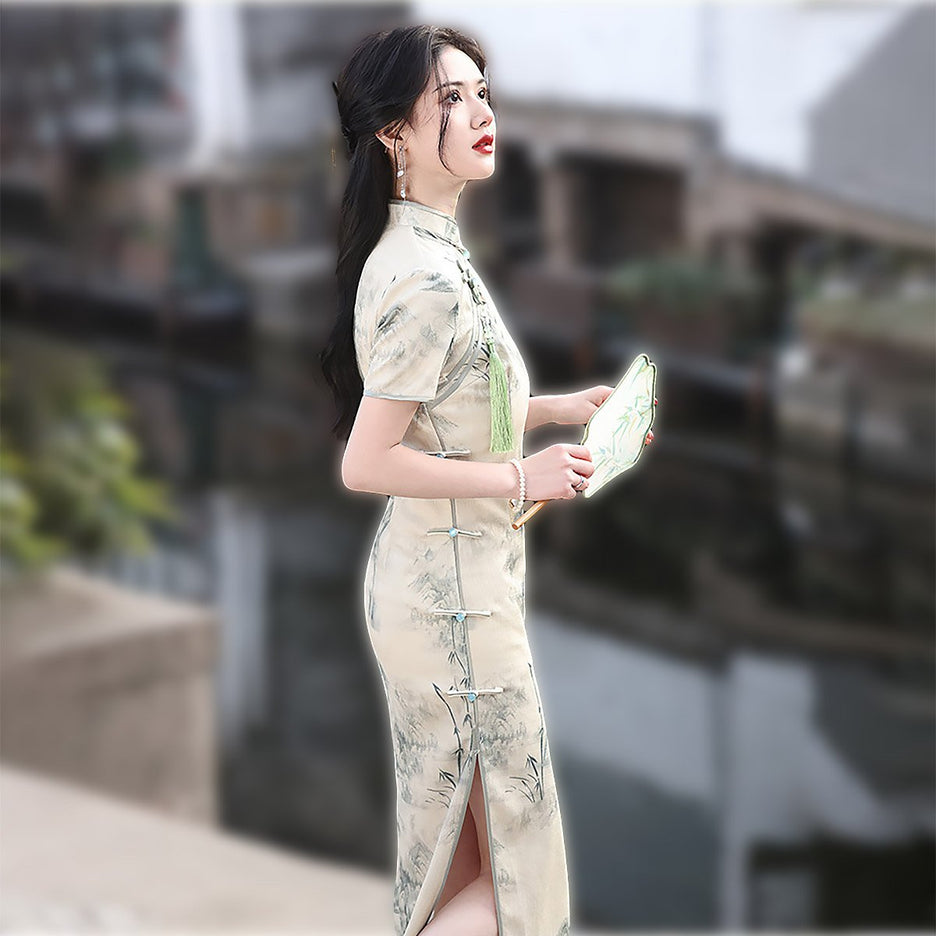 Chinese traditional cheongsam with landscape paintings